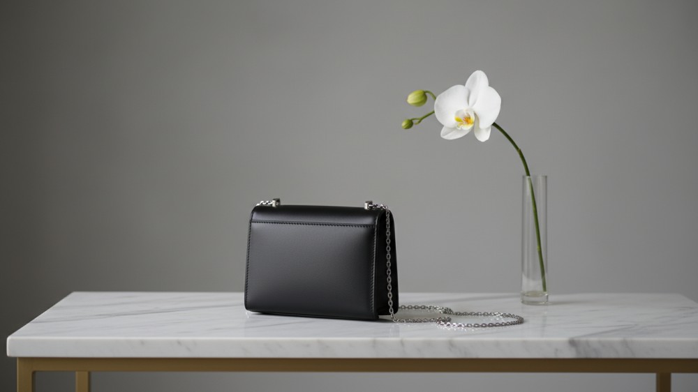 structured-black-leather-micro-bag-on-marble-elegant-setting