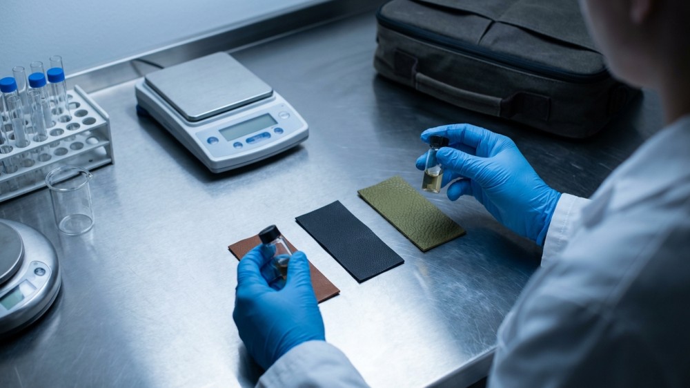 technician-testing-leather-and-alternative-swatches