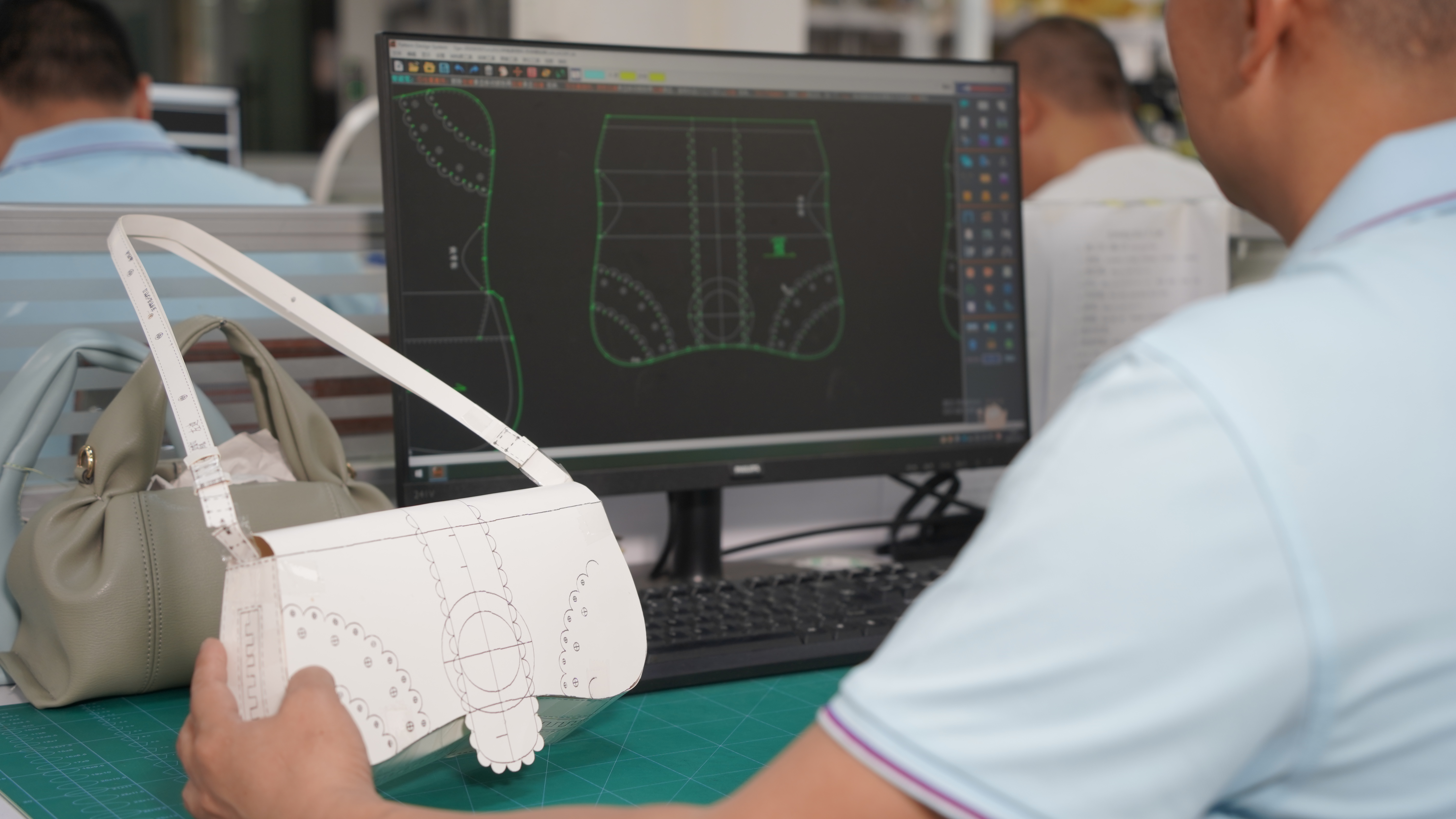 R&D Team Working on Handbag Sample CADs
