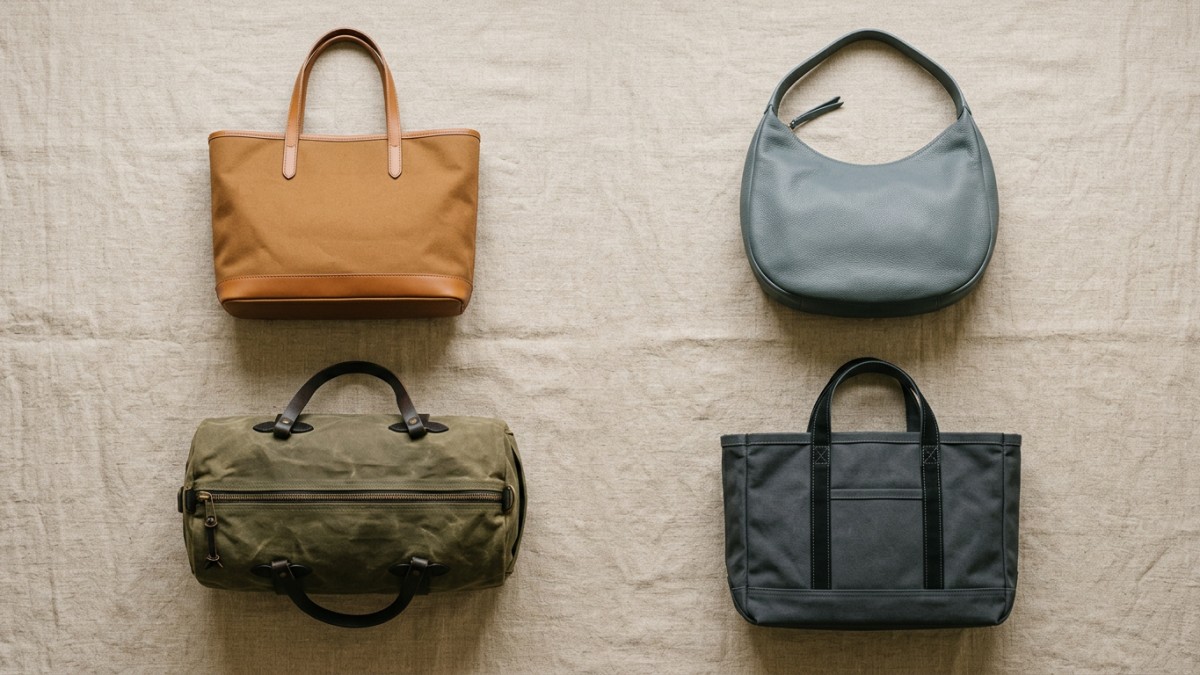 Overhead flat-lay of four bag silhouettes: tote, hobo, duffle, and heavy-duty tote