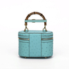 Genuine Ostrich Leather Women's Oval Cosmetic Crossbody with Bamboo Handle