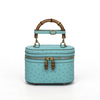 Genuine Ostrich Leather Women's Oval Cosmetic Crossbody with Bamboo Handle